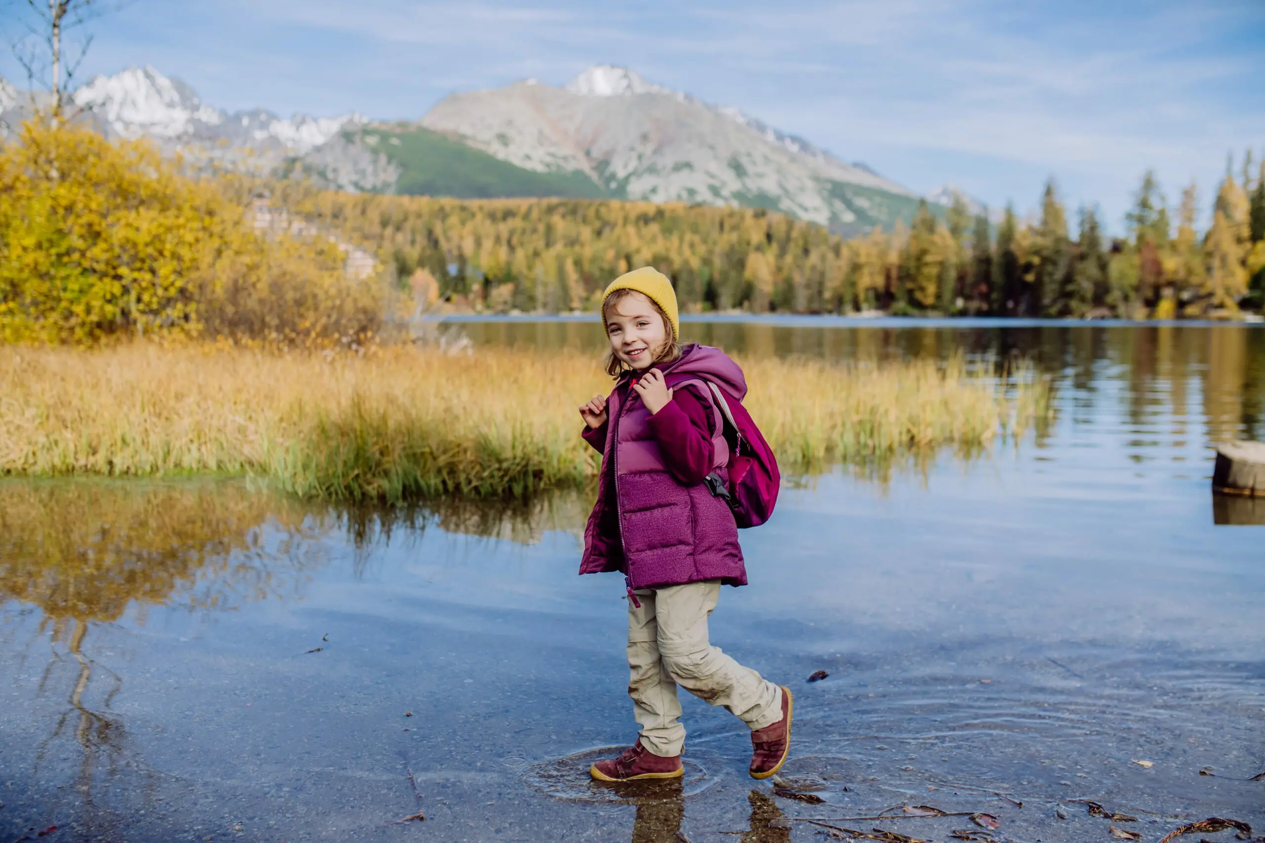 little-girl-walking-in-the-shore-of-lake-in-the-m-2022-11-02-03-19-15-utc-min
