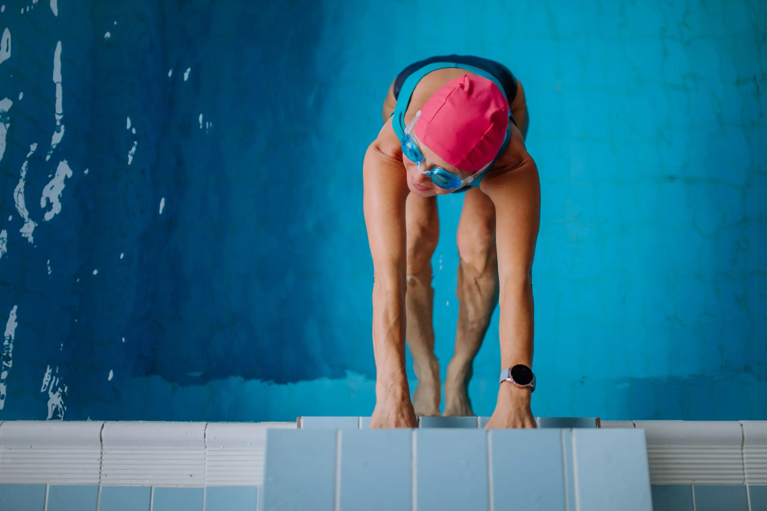 top-view-of-active-senior-woman-swimmer-holding-on-2023-11-27-05-27-28-utc-min